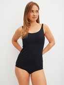 Women model is wearing Tank top with bustier made of Modal in Black, Unicoloured from the Natural Skin series by CALIDA, Outfit