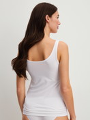 Women model is wearing Tank Top, 2-Pack made of Cotton in Green, Unicoloured from the Benefit Women Spec. series by CALIDA, Additional Image