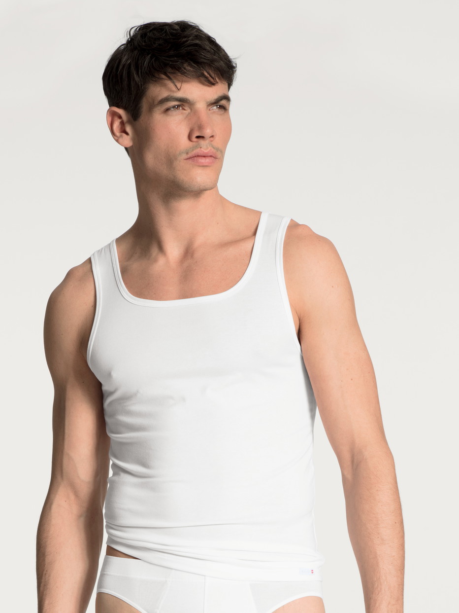 Men model is wearing Tank-Top made of Cotton in White, Unicoloured from the Evolution series by CALIDA, Front view