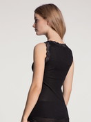 Women model is wearing Tank top made of Wool in Black, Lace from the Richesse Lace series by CALIDA, Back view