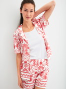 Women model is wearing Short-sleeved shirt with buttons made of 100% Cotton in Orange, Floral from the Favourites Beach series by CALIDA, Front view
