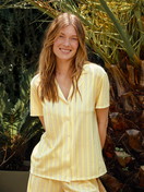 Women model is wearing Short-sleeved shirt with buttons made of 100% Cotton in Yellow, Striped from the Favourites Ocean series by CALIDA, Front view