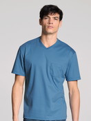 Men model is wearing Short-sleeve shirt made of 100% Cotton in Blue, Unicoloured from the Remix Xtra series by CALIDA, Front view