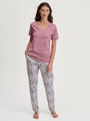 Women model is wearing Short-sleeved shirt made of 100% Cotton in Pink, Unicoloured from the Favourites Botanic series by CALIDA, Outfit