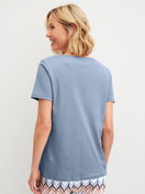 Women model is wearing Short-sleeved shirt made of 100% Cotton in Blue, Unicoloured from the Favourites Tiles series by CALIDA, Back view