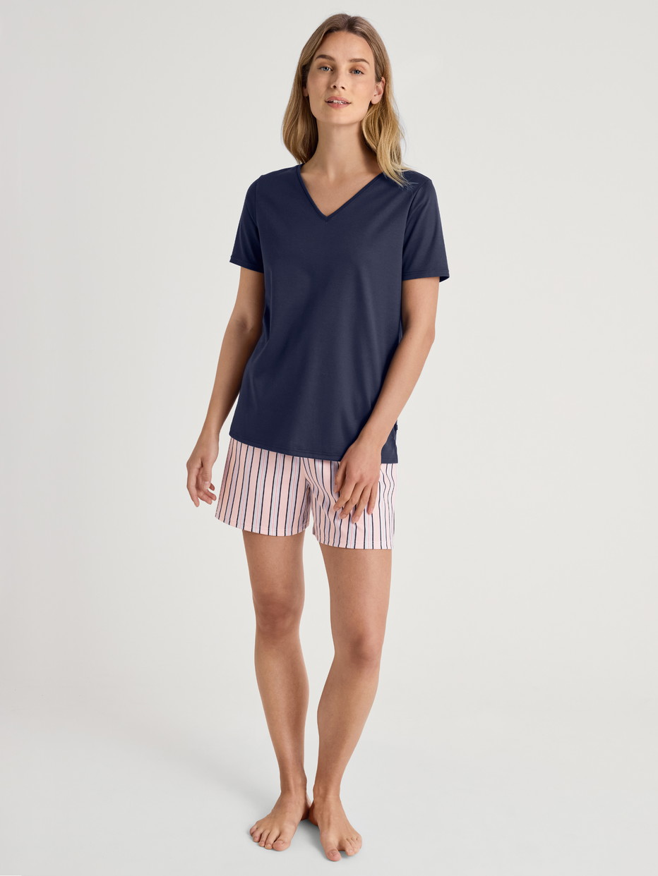 Women model is wearing Short-sleeved shirt made of 100% Cotton in Blue, Unicoloured from the Favourites Sleep series by CALIDA, Additional Image