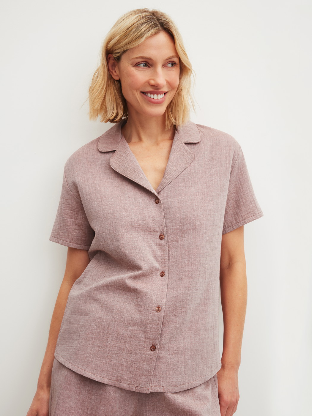 Women model is wearing Short-sleeved shirt with buttons made of 100% Cotton in Brown, Unicoloured from the Favourites Tiles series by CALIDA, Front view