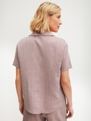 Women model is wearing Short-sleeved shirt with buttons made of 100% Cotton in Brown, Unicoloured from the Favourites Tiles series by CALIDA, Back view