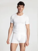 Men model is wearing T-Shirt, 2-Pack made of Cotton in White, Unicoloured from the Natural Benefit series by CALIDA, Front view, Outfit