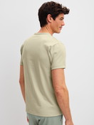 Men model is wearing Short-sleeved shirt made of 100% Cotton in Green, Unicoloured from the RMX Sleep Leisure series by CALIDA, Back view
