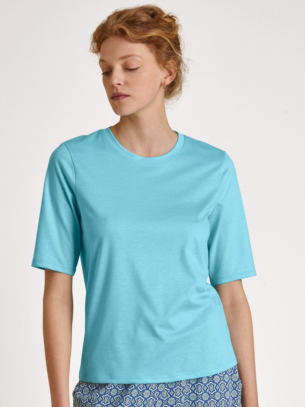 Le mannequin Femme porte le/la T-Shirt à manches courtes en Modal de couleur Turquoise, Unicolore, de la série Favourites Energy de CALIDA, Vue de face
