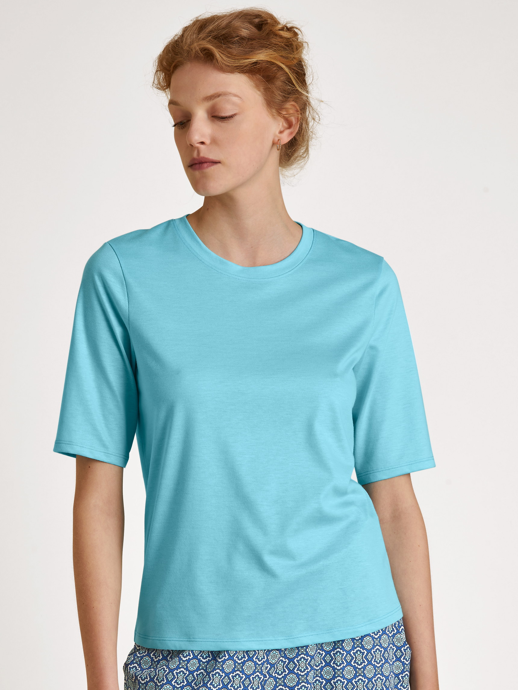 Le mannequin Femme porte le/la T-Shirt à manches courtes en Modal de couleur Turquoise, Unicolore, de la série Favourites Energy de CALIDA, Vue de face