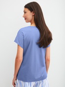 Women model is wearing Short-sleeved shirt with V-neck made of Cotton in Blue, Unicoloured from the Favourites Ocean series by CALIDA, Back view