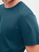 Men model is wearing Short-sleeved shirt made of Pima® Cotton in Turquoise, Unicoloured from the RMX Sleep Free series by CALIDA, Detail
