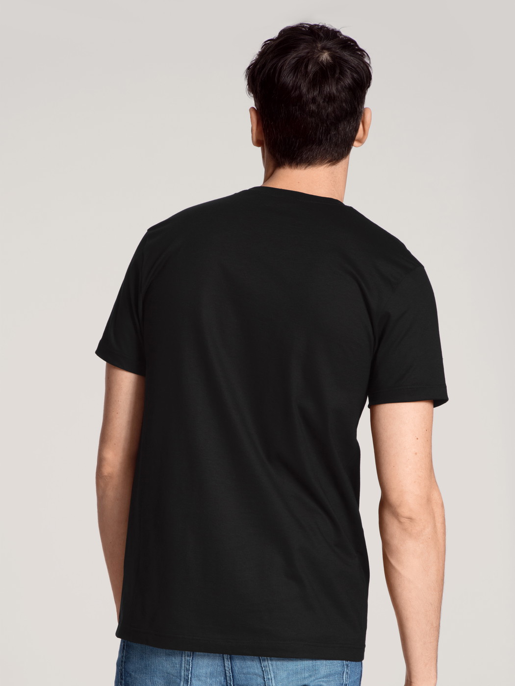La modella / Il modello Uomo indossa T-Shirt, 2er-Pack in 100% cotone di colore Nero, Tinta unita, della serie Natural Benefit di CALIDA, Vista posteriore