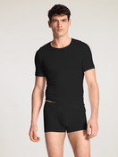 Men model is wearing T-Shirt made of Lyocell in Black, Unicoloured from the Focus series by CALIDA, Outfit