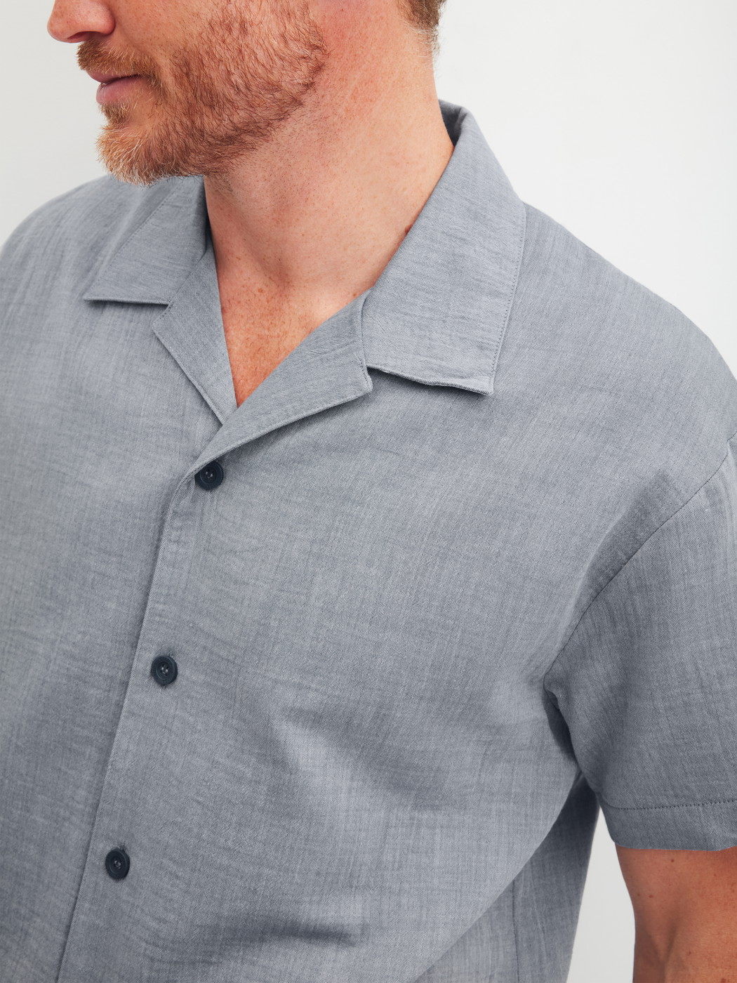 Men model is wearing Short shirt with button facing made of 100% Cotton in Grey, Unicoloured from the RMX Sleep Journey series by CALIDA, Detail
