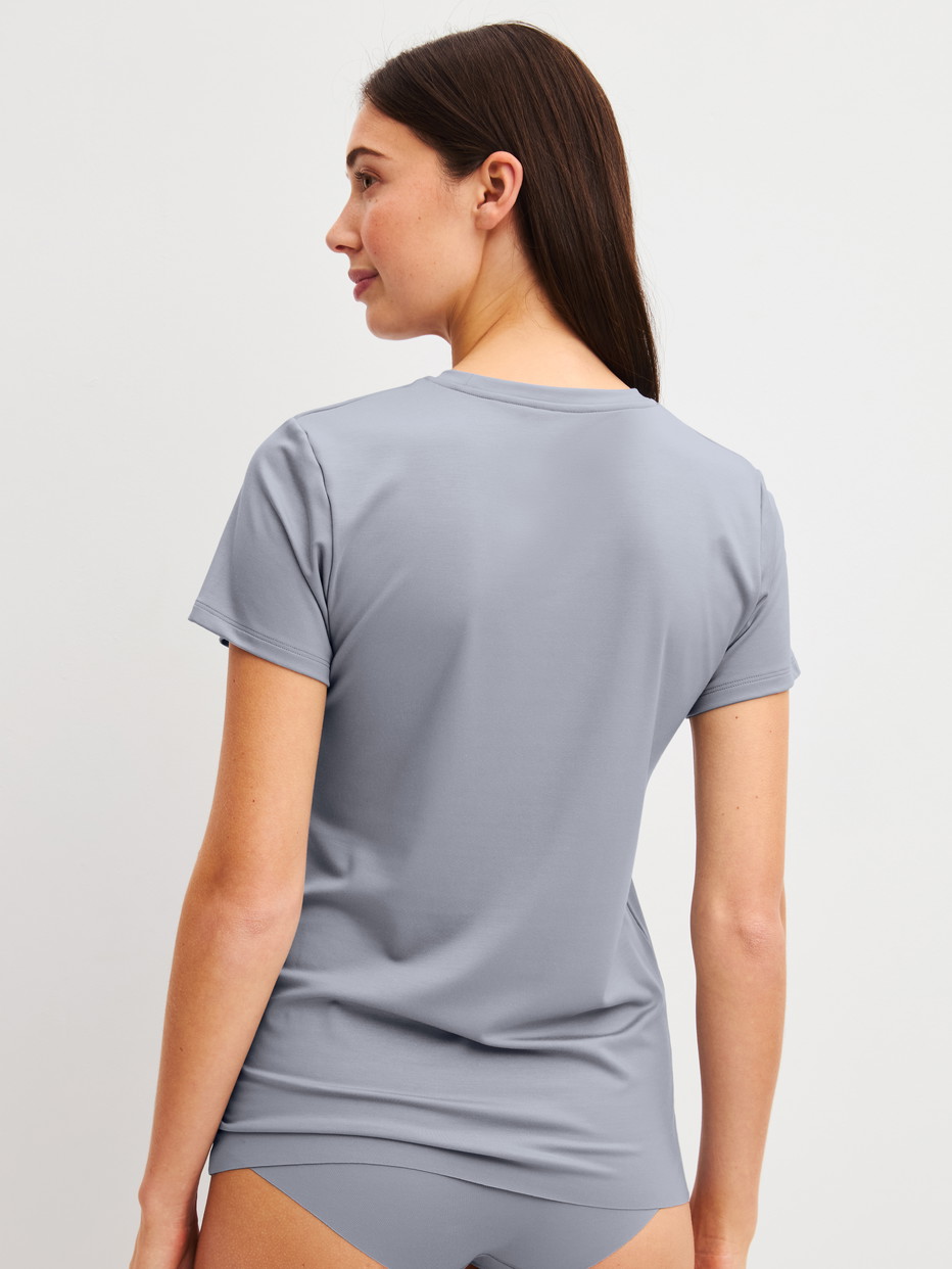 Women model is wearing Shirt short sleeve made of Modal in Grey, Unicoloured from the Natural Skin series by CALIDA, Back view