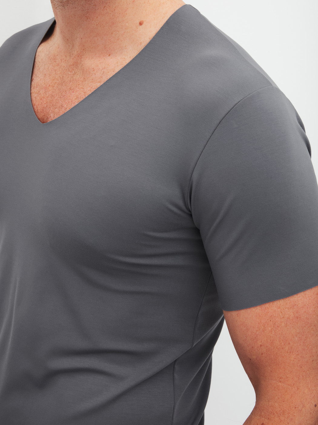 Men model is wearing V-shirt made of Modal in Grey, Unicoloured from the Clean Line series by CALIDA, Front view