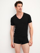Men model is wearing V-shirt made of Modal in Black, Unicoloured from the Clean Line series by CALIDA, Outfit