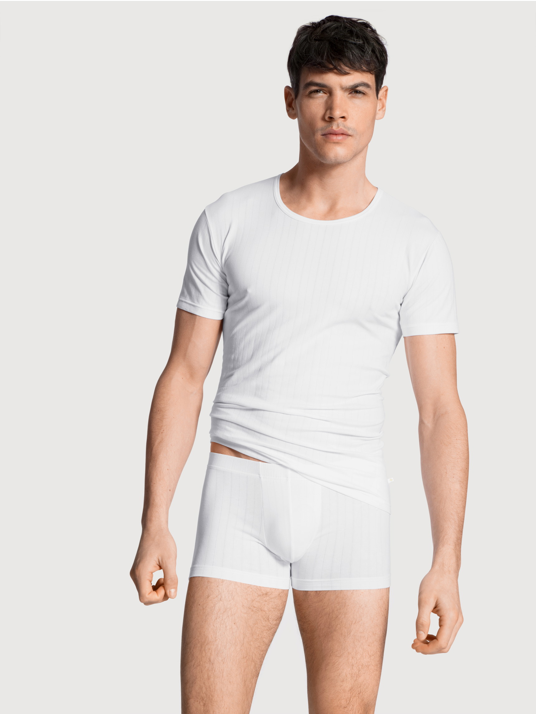 Men model is wearing T-shirt made of Cotton in White, Unicoloured from the Pure & Style series by CALIDA, Outfit, Front view