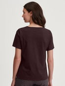 Women model is wearing Shirt short sleeve made of 100% Cotton in Red, Unicoloured from the Favourites Botanic series by CALIDA, Back view