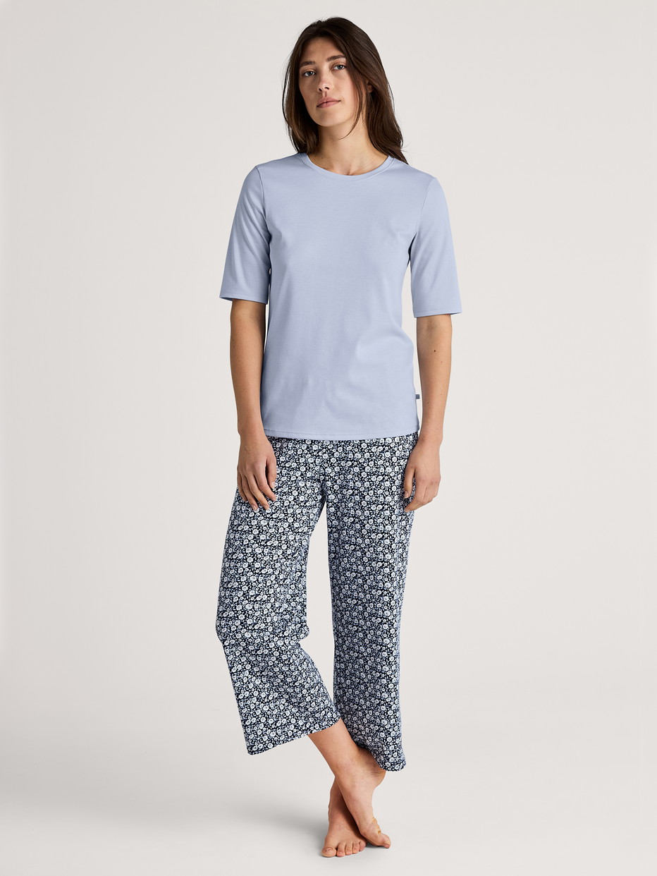 Women model is wearing Short-sleeved shirt made of 100% Cotton in Blue, Unicoloured from the Favourites Sleep series by CALIDA, Outfit