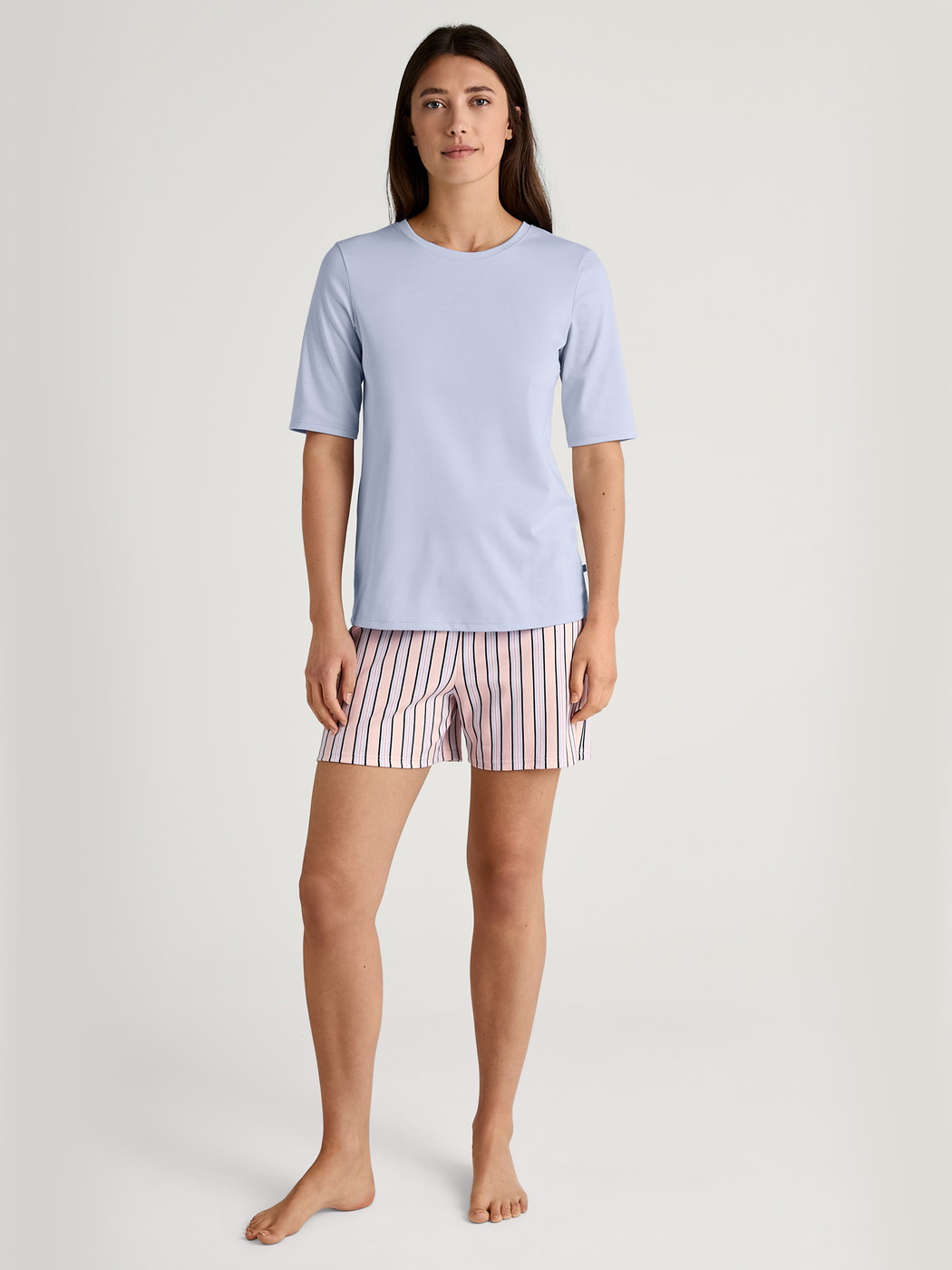 Women model is wearing Short-sleeved shirt made of 100% Cotton in Blue, Unicoloured from the Favourites Sleep series by CALIDA, Additional Image