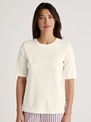Women model is wearing Short-sleeved shirt made of 100% Cotton in White, Unicoloured from the Favourites Sleep series by CALIDA, Front view