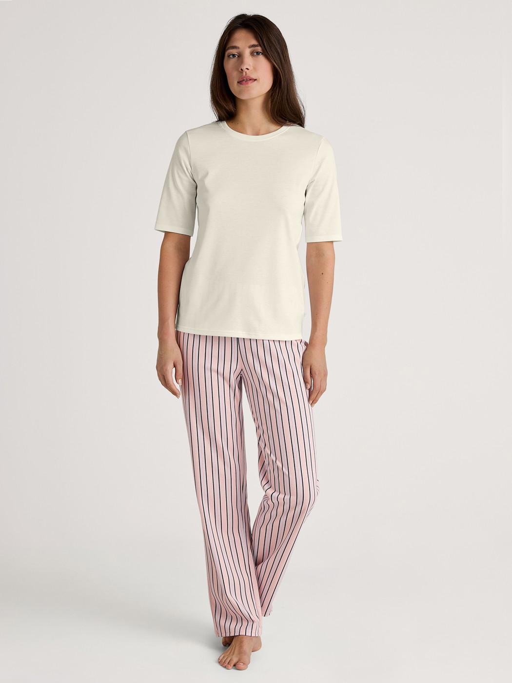 Women model is wearing Short-sleeved shirt made of 100% Cotton in White, Unicoloured from the Favourites Sleep series by CALIDA, Outfit