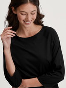 Le mannequin Femme porte le/la T-shirt manche 3/4 en Coton de couleur Noir, Unicolore, de la série Favourites Journey de CALIDA, Vue de face
