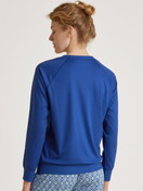 Women model is wearing Shirt long sleeve made of 100% Cotton in Blue, Unicoloured from the Favourites Energy series by CALIDA, Back view