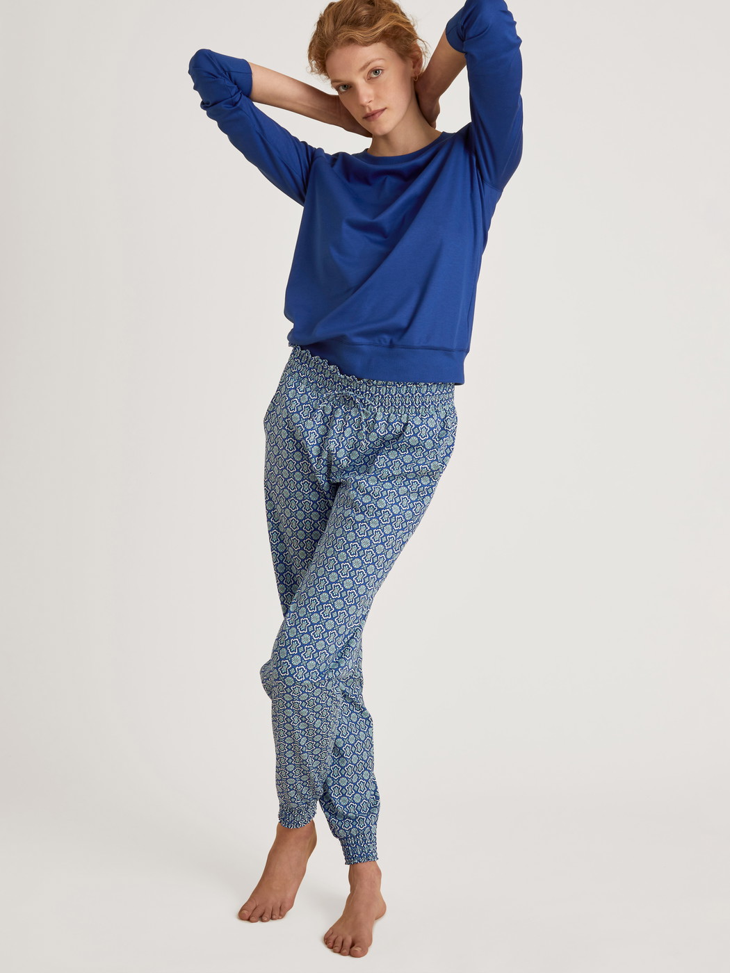 Women model is wearing Shirt long sleeve made of 100% Cotton in Blue, Unicoloured from the Favourites Energy series by CALIDA