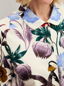 Women model is wearing Long-sleeve shirt with buttons made of 100% Cotton in Beige, Floral from the Alpine M&M series by CALIDA, Detail