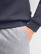 Men model is wearing Sweatshirt made of Cotton in Grey, Unicoloured from the RMX Lounge Casual series by CALIDA, Detail
