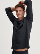 Men model is wearing Shirt long sleeve made of 100% Cotton in Black, Unicoloured from the RMX Sleep Leisure series by CALIDA, Front view