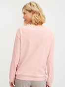 Women model is wearing Long-sleeve shirt with raglan sleeves made of 100% Cotton in Pink, Unicoloured from the Favourites Arts series by CALIDA, Back view