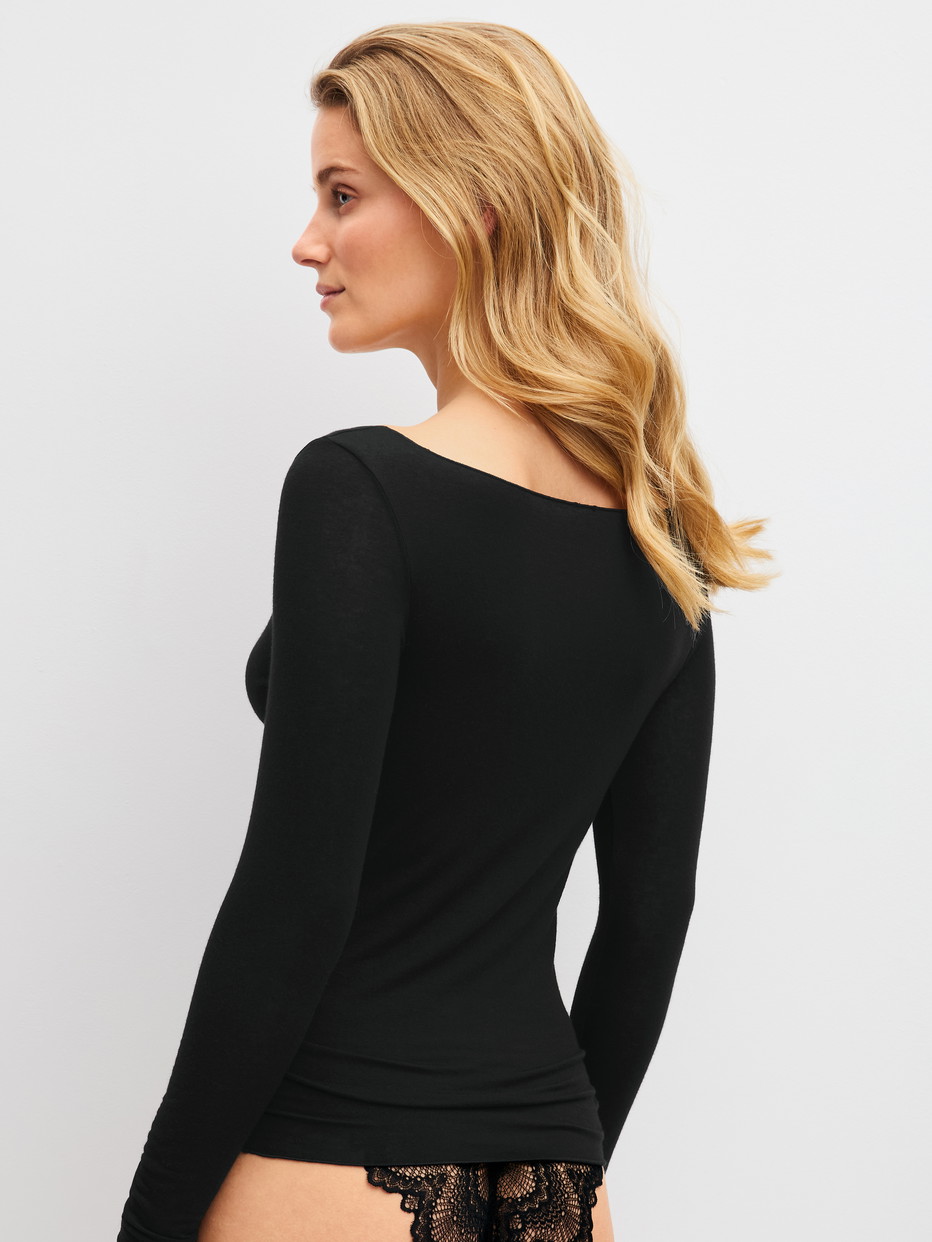 Women model is wearing  made of Modal in Black, Unicoloured from the Second Skin series by CALIDA, Back view