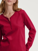 Women model is wearing Shirt long sleeve made of 100% Cotton in Red, Unicoloured from the Favourites Holidays series by CALIDA, Detail