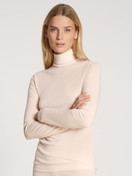 Women model is wearing Long-sleeve turtleneck shirt in wool-silk made of Swiss+Cotton in Beige, Unicoloured from the True Confidence series by CALIDA, Front view
