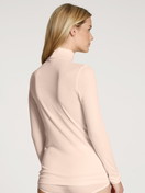 Women model is wearing Long-sleeve turtleneck shirt in wool-silk made of Swiss+Cotton in Beige, Unicoloured from the True Confidence series by CALIDA, Back view