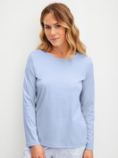 Women model is wearing Shirt long sleeve made of 100% Cotton in Blue, Unicoloured from the Favourites Cosy series by CALIDA, Front view