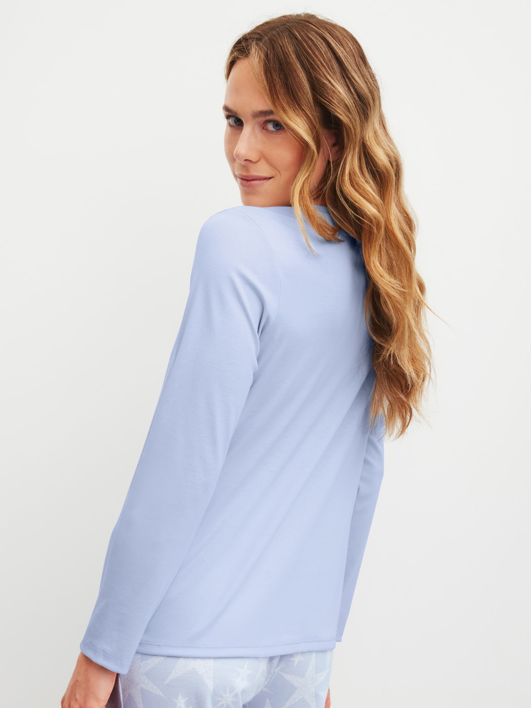 Women model is wearing Shirt long sleeve made of 100% Cotton in Blue, Unicoloured from the Favourites Cosy series by CALIDA, Back view