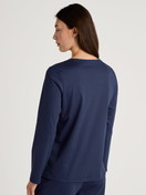 Women model is wearing Shirt long sleeve made of 100% Cotton in Blue, Floral from the Favourites Sleep series by CALIDA, Back view