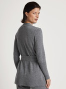 Women model is wearing Cardigan made of merino wool made of Wool in Grey, Unicoloured from the The Cosy Collection series by CALIDA, Back view