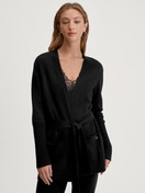 Women model is wearing Cardigan made of merino wool made of Wool in Black, Unicoloured from the The Cosy Collection series by CALIDA, Front view