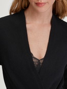 Women model is wearing Cardigan made of merino wool made of Wool in Black, Unicoloured from the The Cosy Collection series by CALIDA, Detail