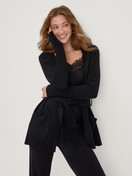 Women model is wearing Cardigan made of merino wool made of Wool in Black, Unicoloured from the The Cosy Collection series by CALIDA, Front view