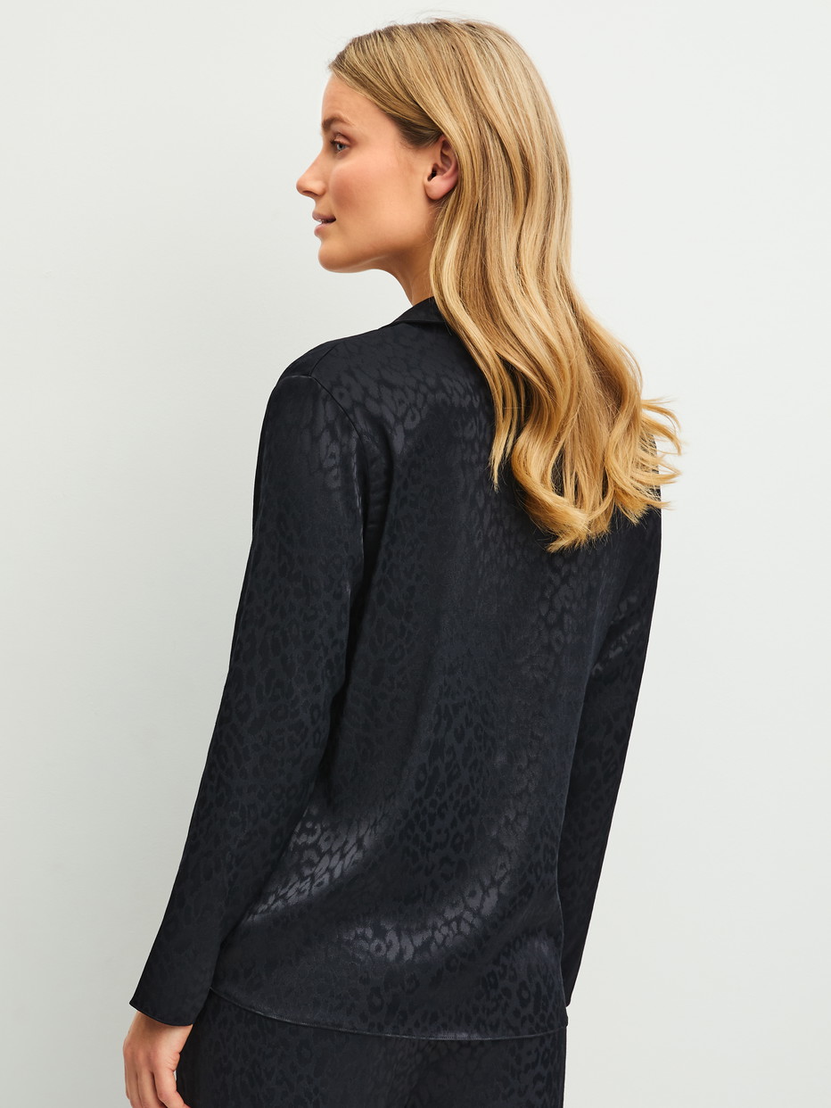 La modella / Il modello Donna indossa  in Viscosa di colore Nero, Modello, della serie Glimmer M&M di CALIDA, Vista posteriore