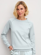 Women model is wearing Long-sleeve shirt made of 100% Cotton in Blue, Unicoloured from the Alpine M&M series by CALIDA, Front view